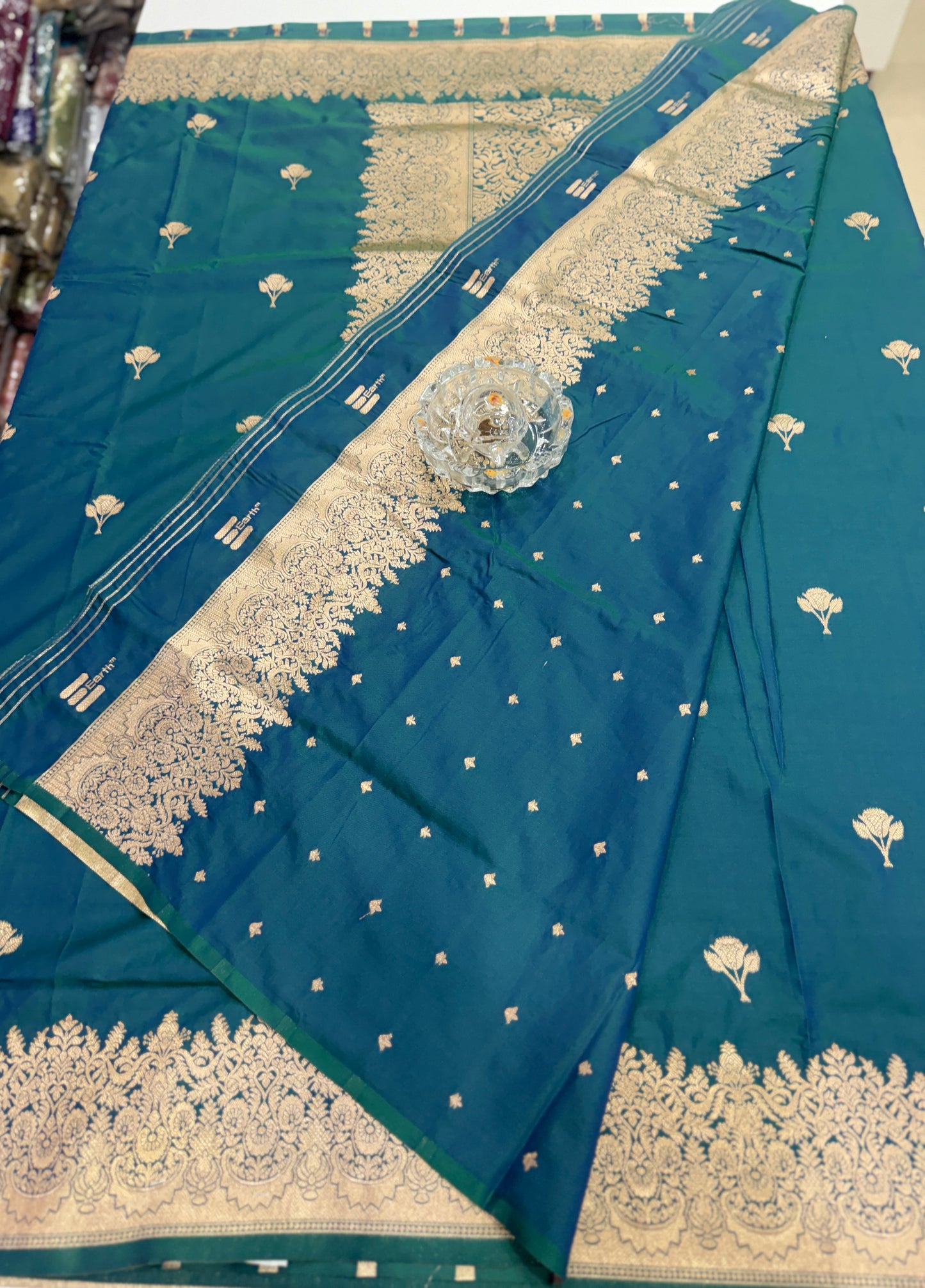 Soft silk saree with woven floral border and contrast brocade blouse piece