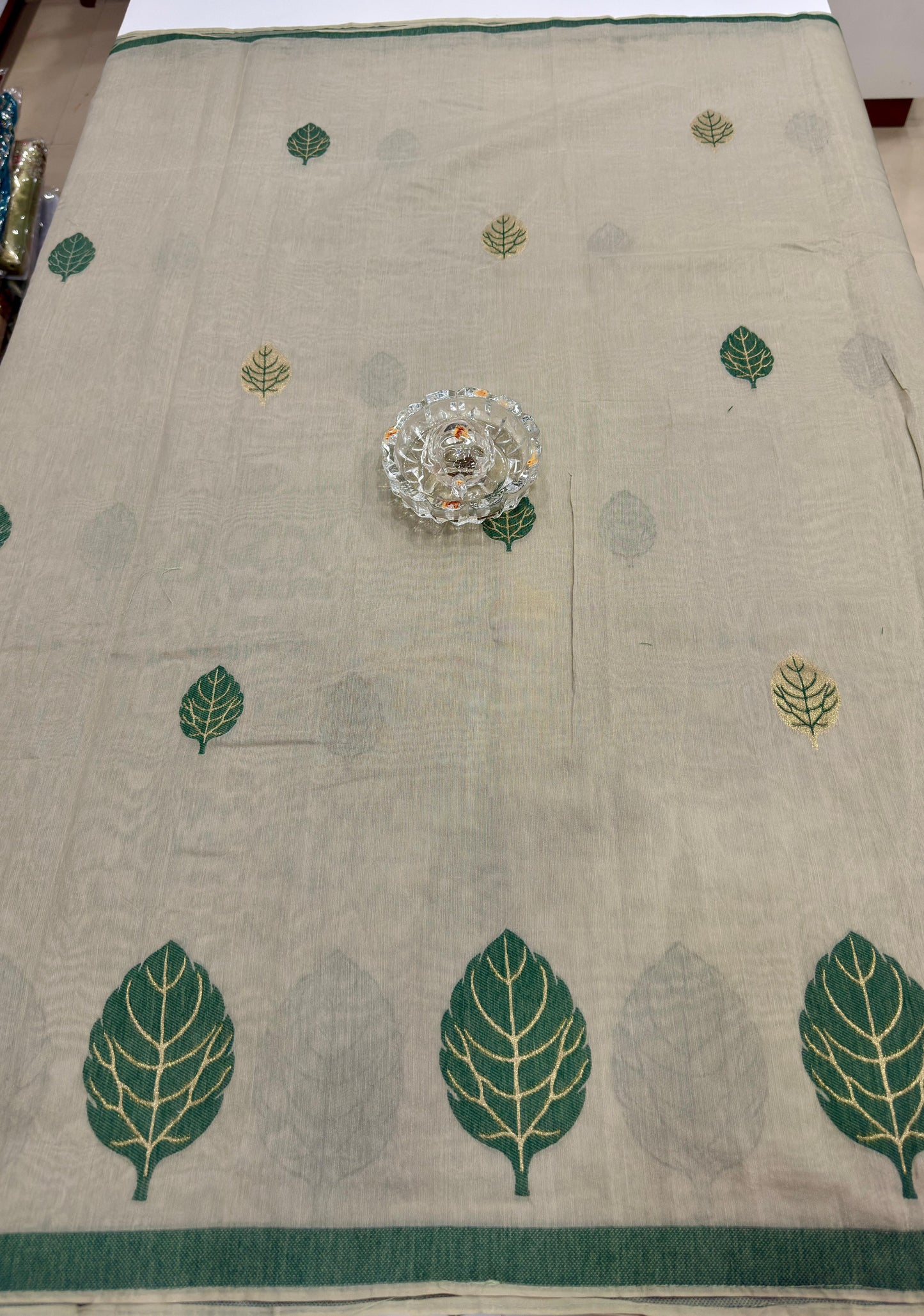 Green kora silk style viscose saree with woven detailing, tassel pallu and embroidered unstitched blouse fabric for women