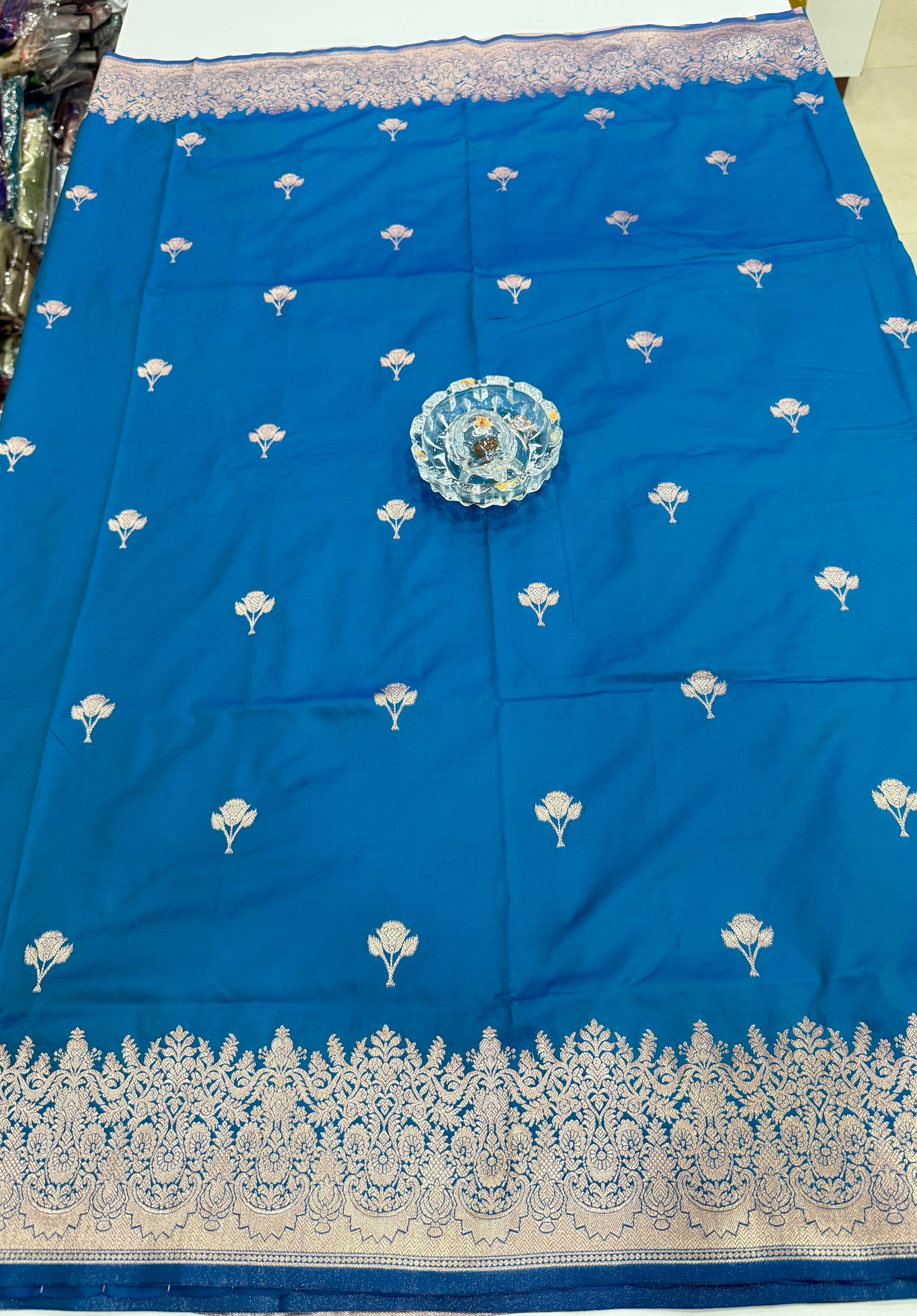 Soft silk saree with woven floral border and contrast brocade blouse piece