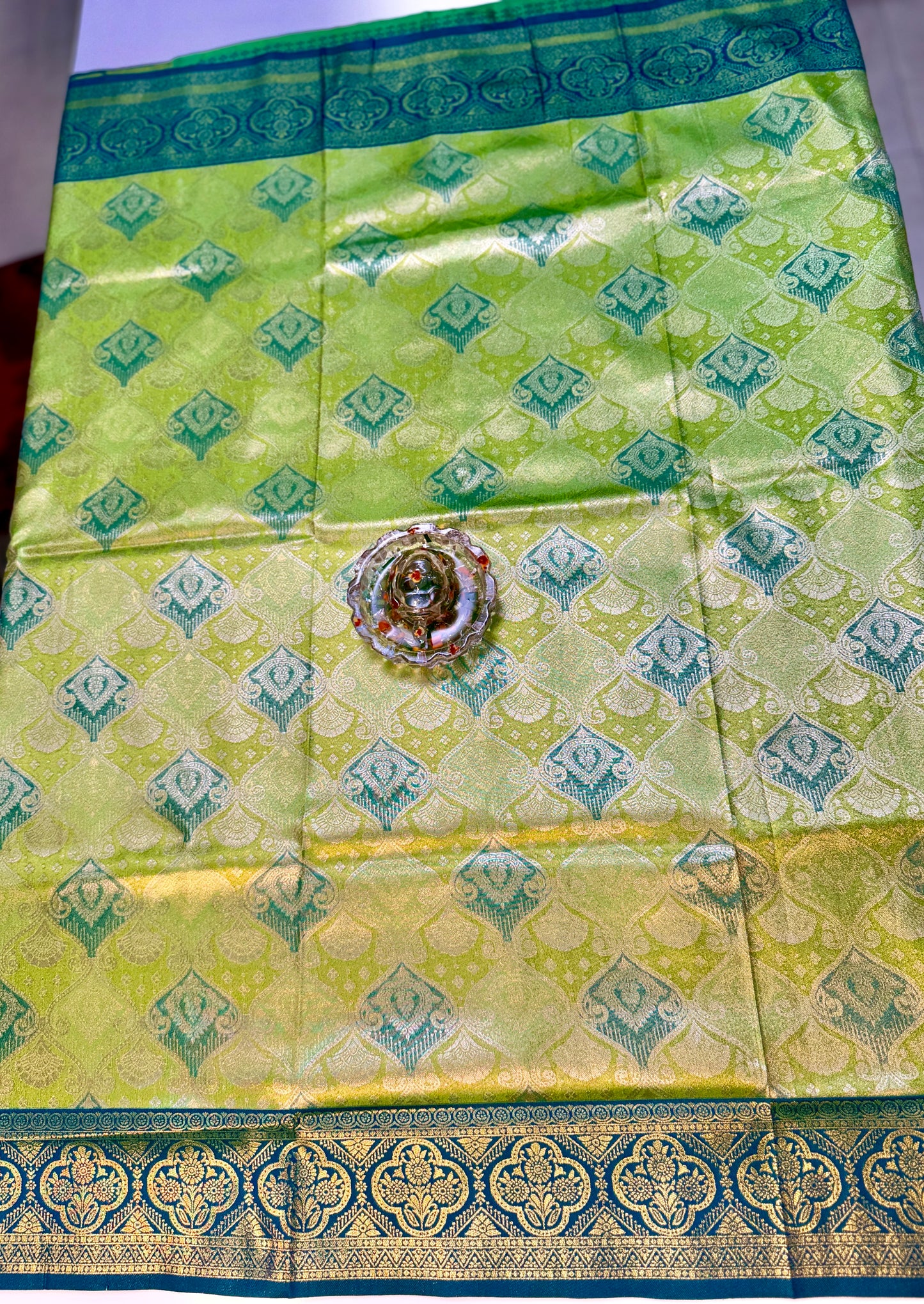 Tissue silk saree with rich zari weaving and contrast border for women
