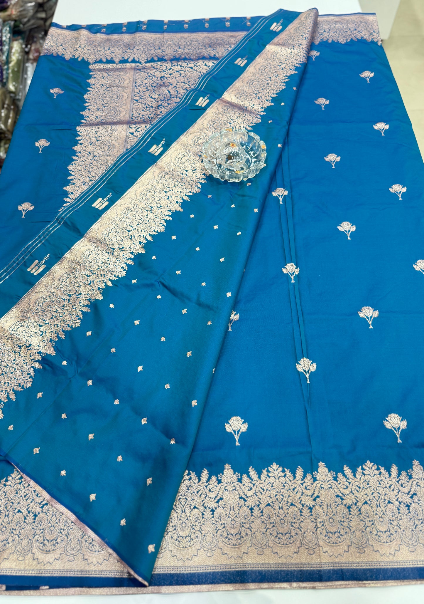 Soft silk saree with woven floral border and contrast brocade blouse piece