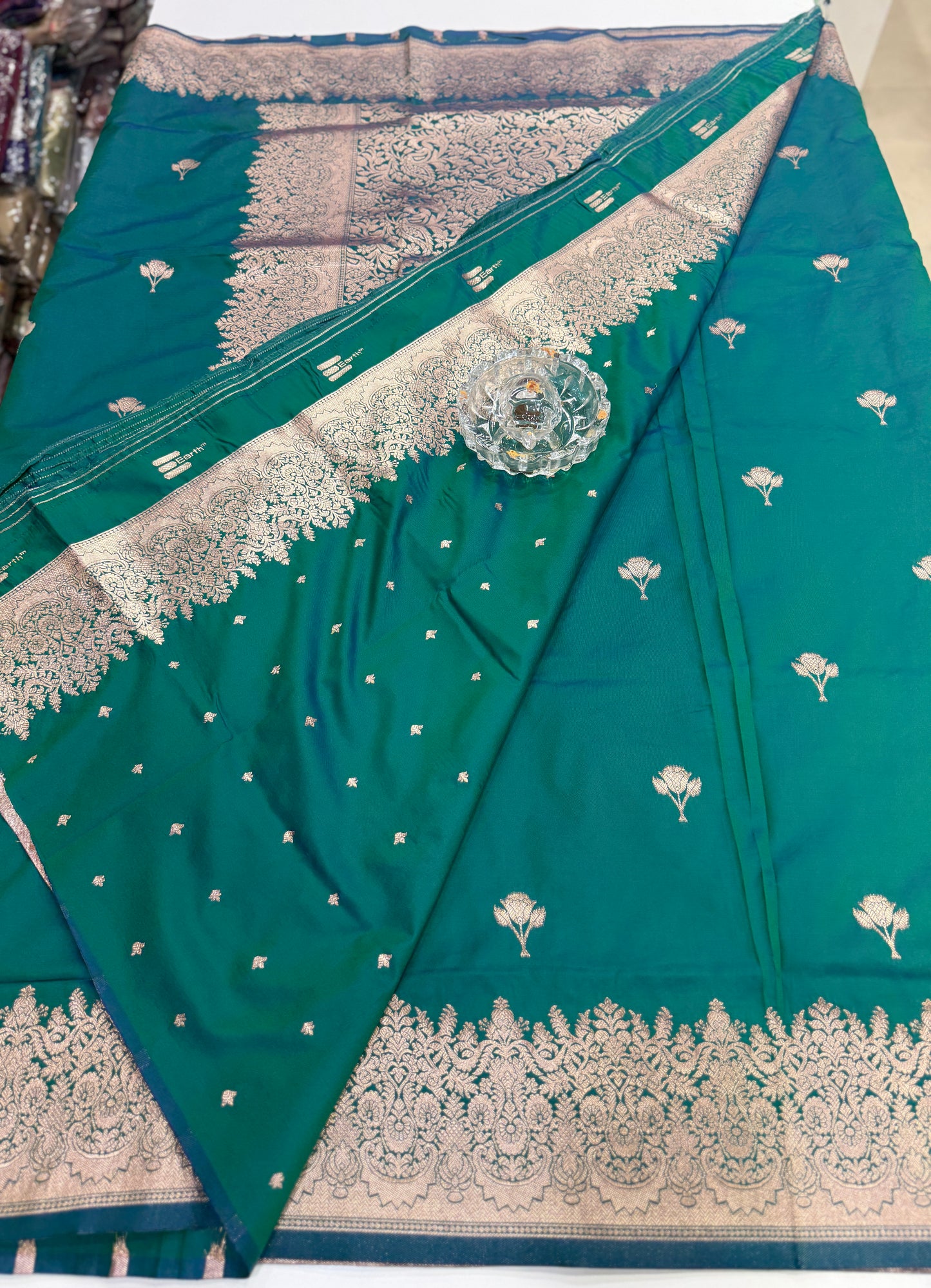 Soft silk saree with woven floral border and contrast brocade blouse piece