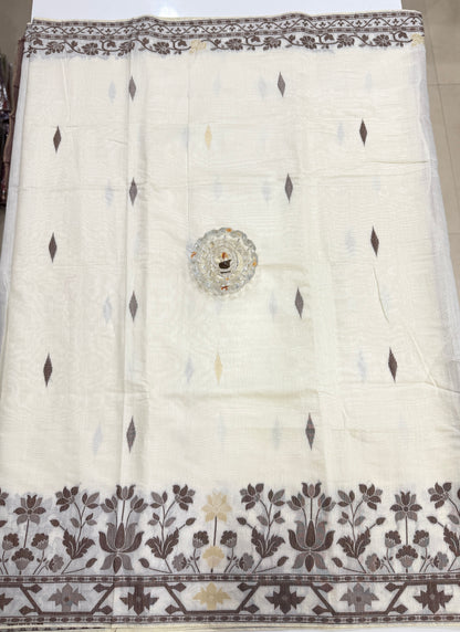 Ivory beige kora silk style viscose saree with woven motifs, tassel pallu and embroidered blouse fabric for women