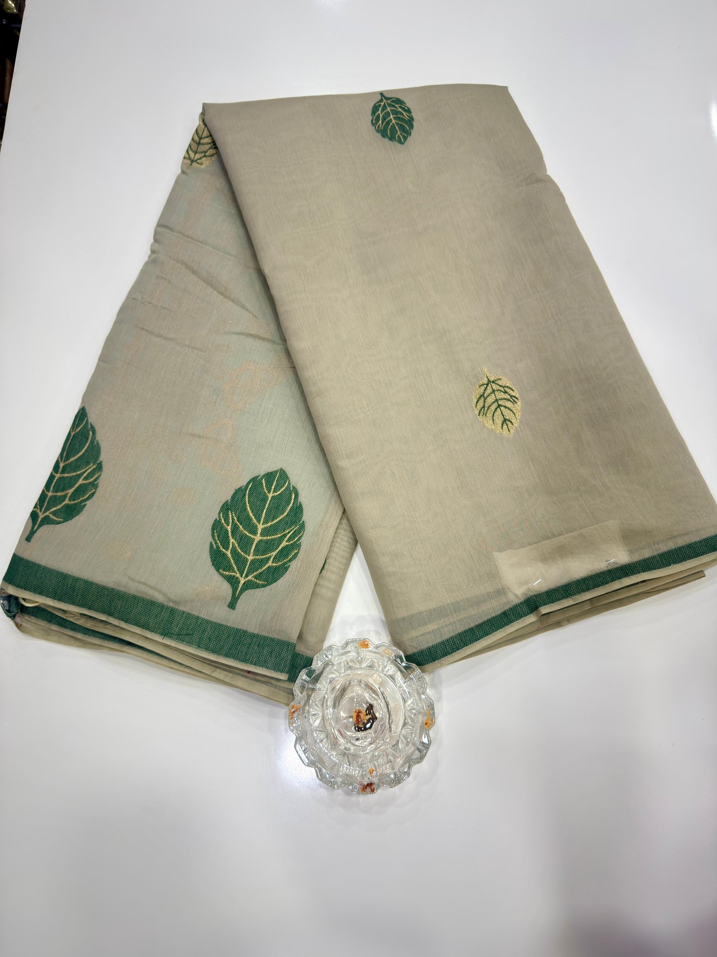 Green kora silk style viscose saree with woven detailing, tassel pallu and embroidered unstitched blouse fabric for women