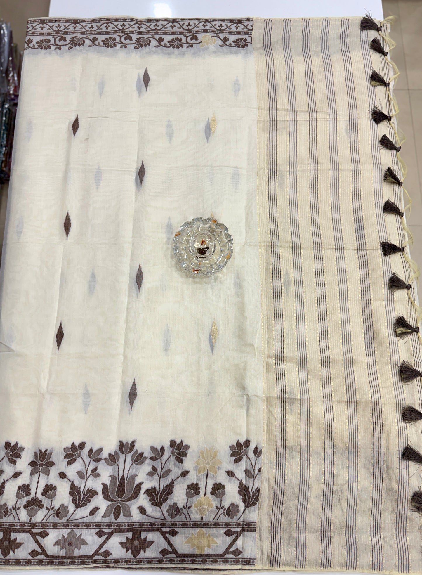 Ivory beige kora silk style viscose saree with woven motifs, tassel pallu and embroidered blouse fabric for women