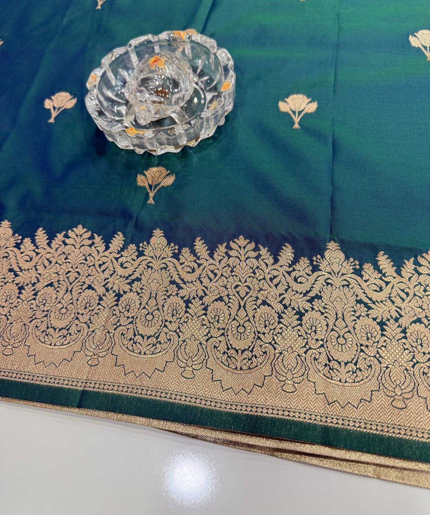 Soft silk saree with woven floral border and contrast brocade blouse piece