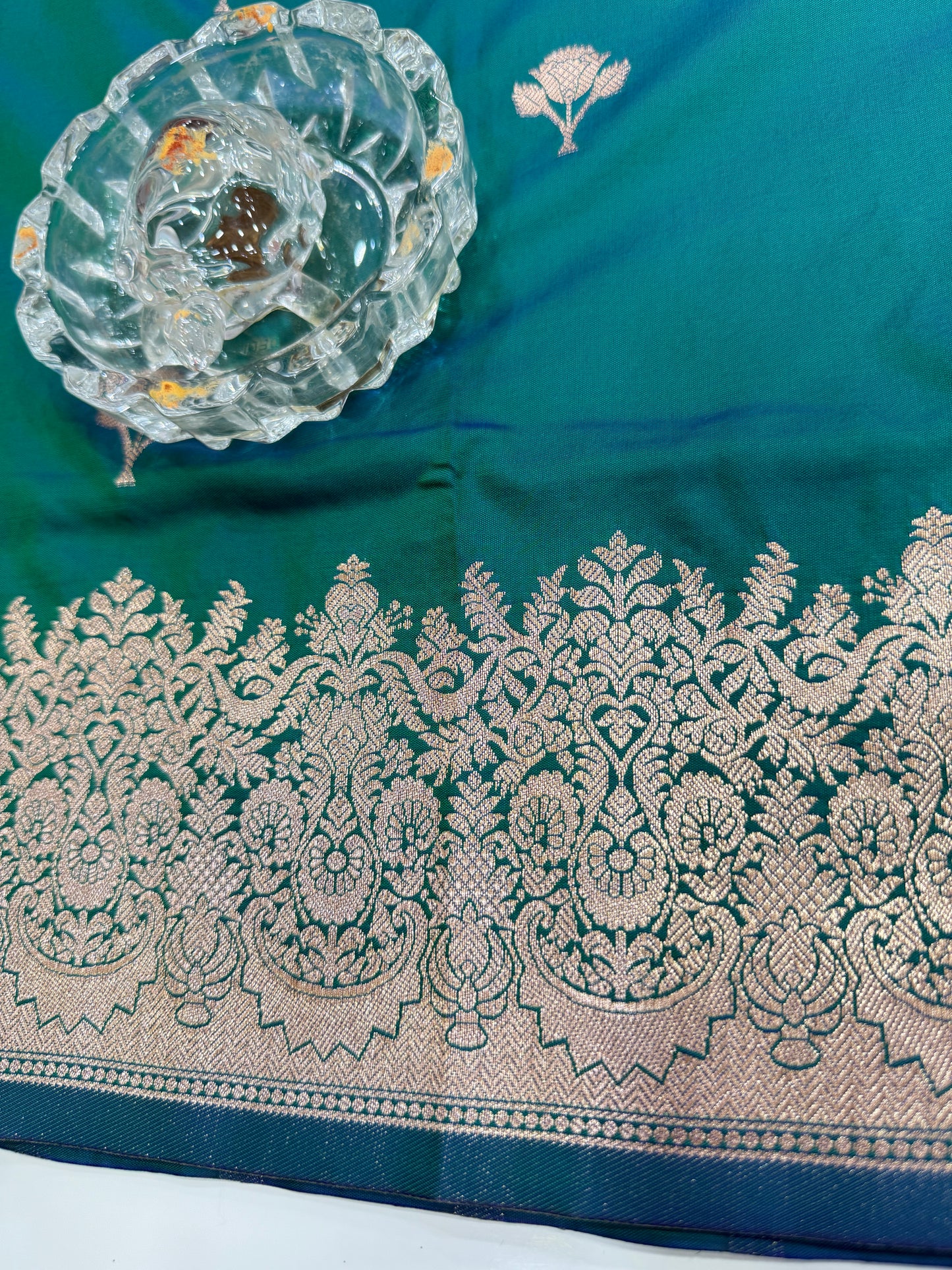 Soft silk saree with woven floral border and contrast brocade blouse piece