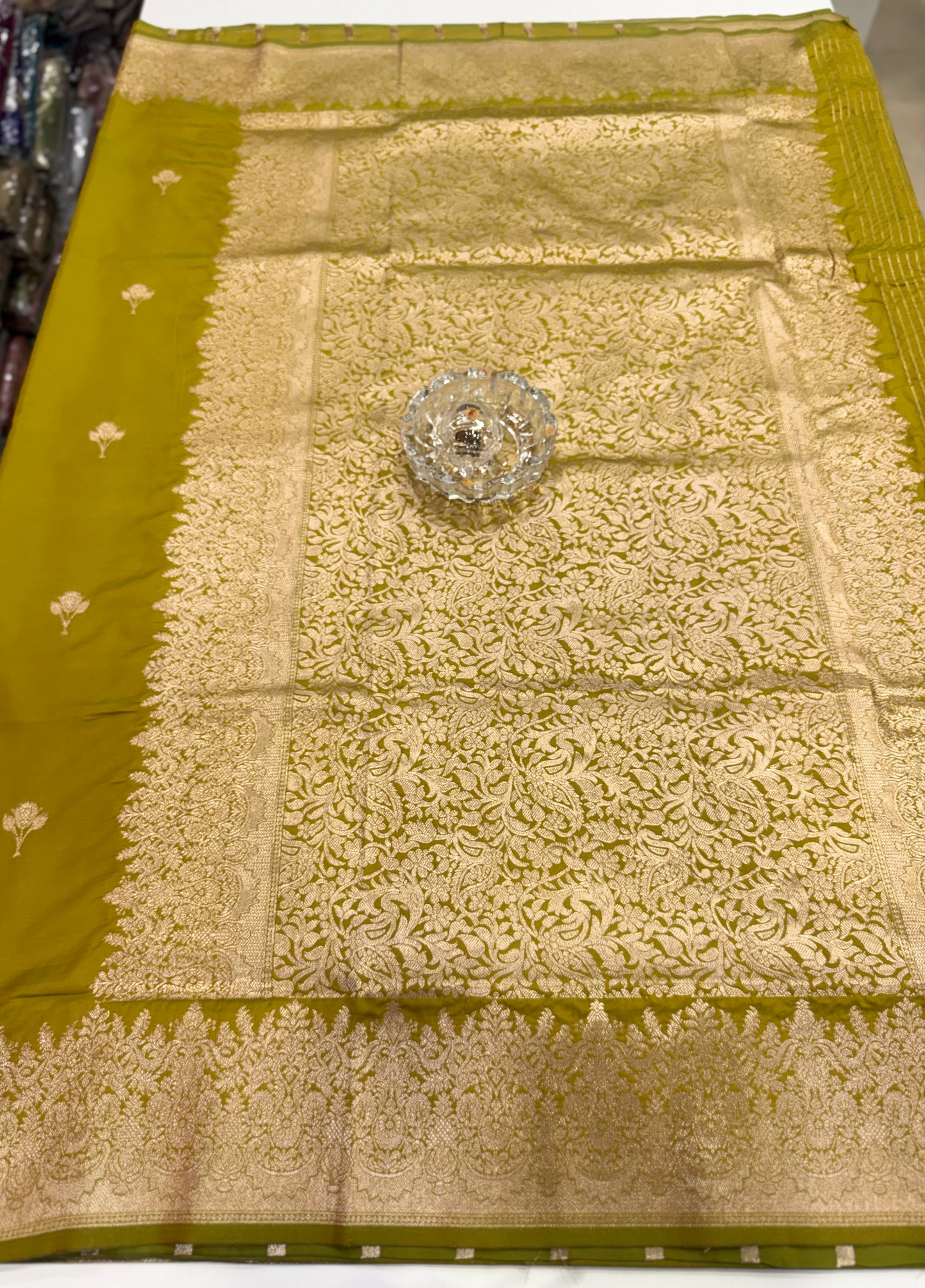 Soft silk saree with woven floral border and contrast brocade blouse piece