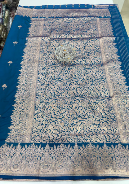 Soft silk saree with woven floral border and contrast brocade blouse piece