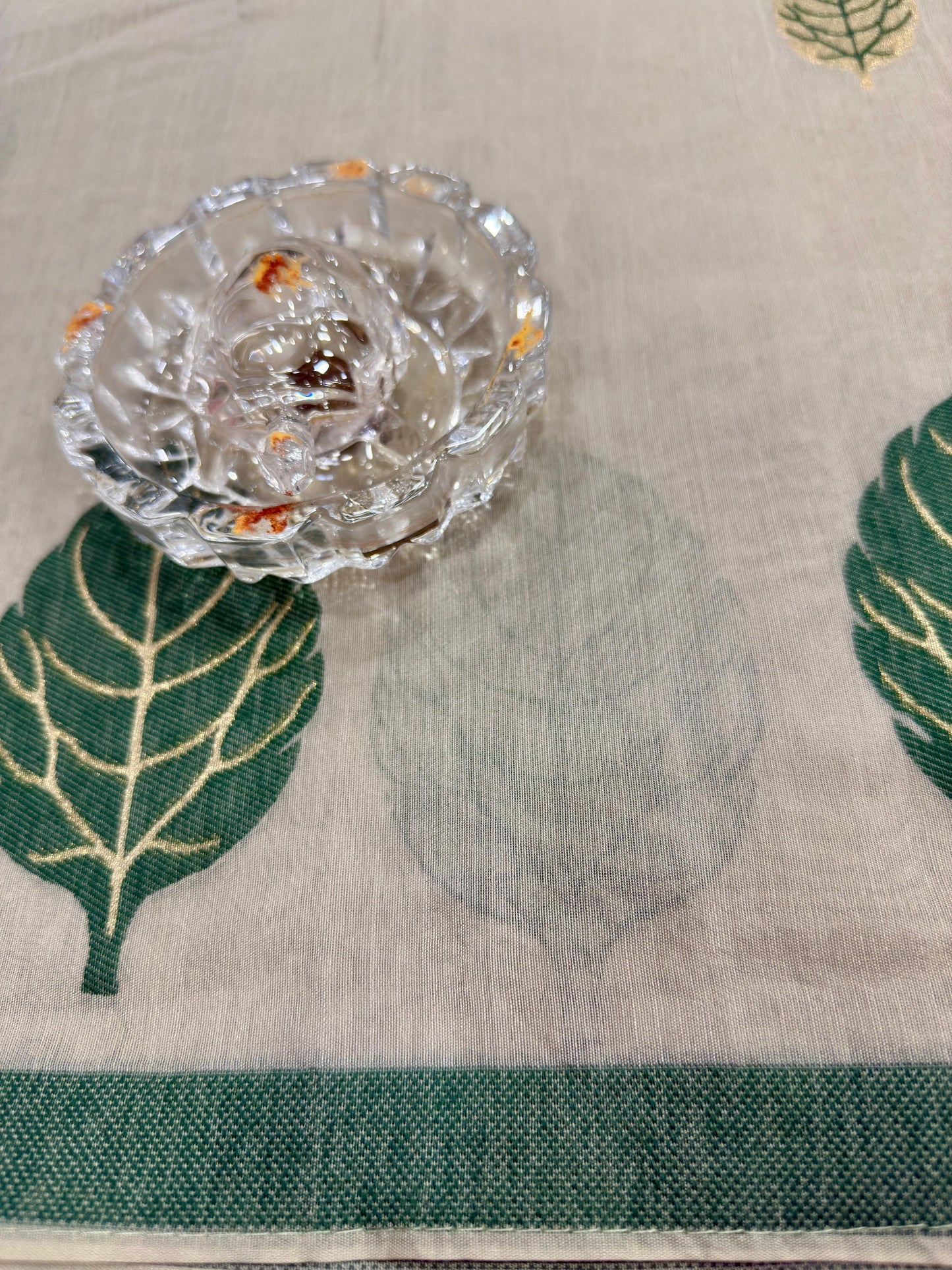 Green kora silk style viscose saree with woven detailing, tassel pallu and embroidered unstitched blouse fabric for women