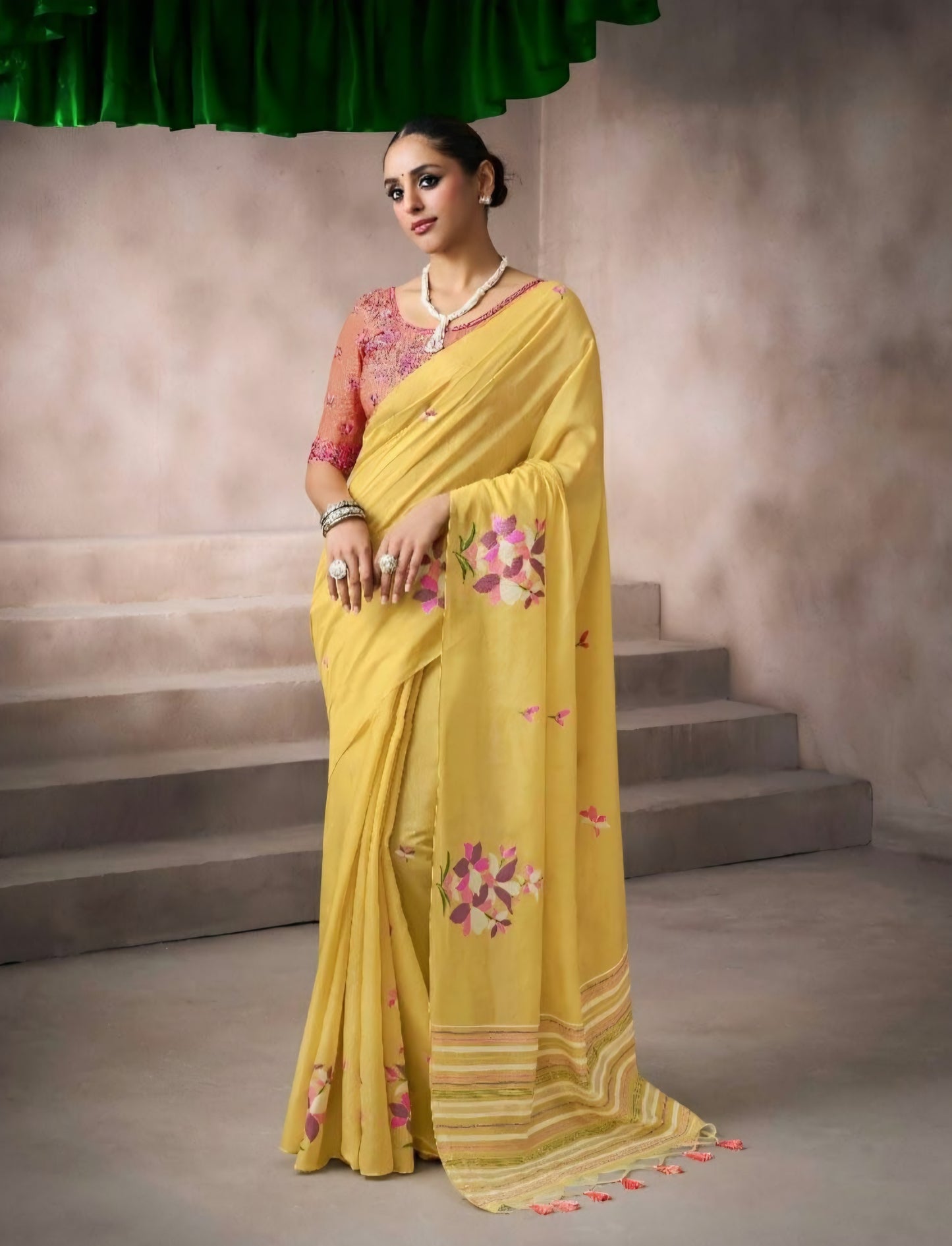 Yellow kora silk style viscose saree with woven floral motifs, tassel pallu and embroidered unstitched blouse fabric for women