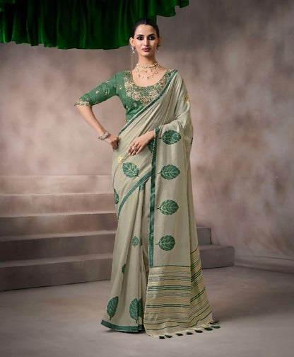 Green kora silk style viscose saree with woven detailing, tassel pallu and embroidered unstitched blouse fabric for women