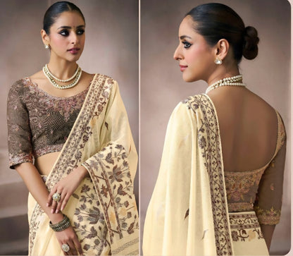 Ivory beige kora silk style viscose saree with woven motifs, tassel pallu and embroidered blouse fabric for women